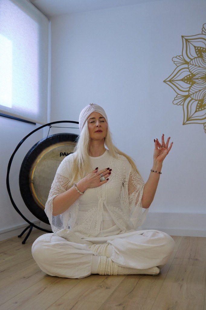 Ksenia Olbut with sacred gong in meditation